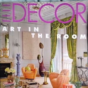 Elle Decor Orange Chevron Accent Chairs with Green Drapes and Gold Accents